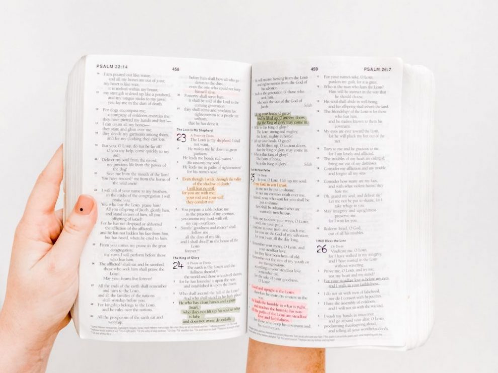 hands-holding-open-bible