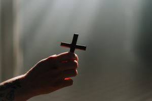 hand-holding-wooden-cross