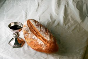 bread-and-wine-on-white-tablecloth