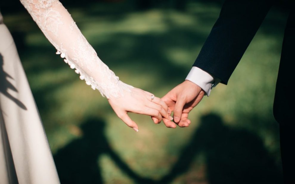 wedding-couple-holding-hands