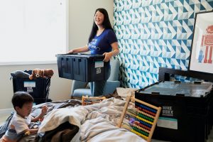 a-woman-packs-up-clutter