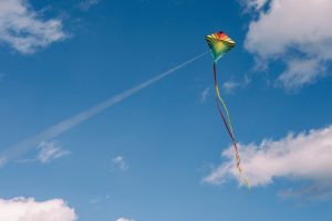 a-rainbow-kite-flies-in-the-air