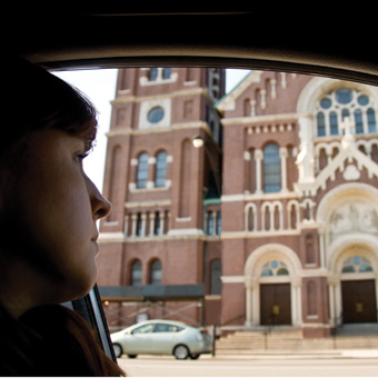 person-in-car-looking-at-church