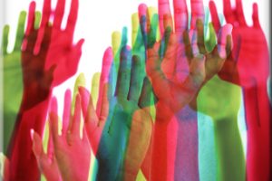 multicolored-hands-raised