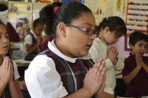 Catholic-school-student-praying