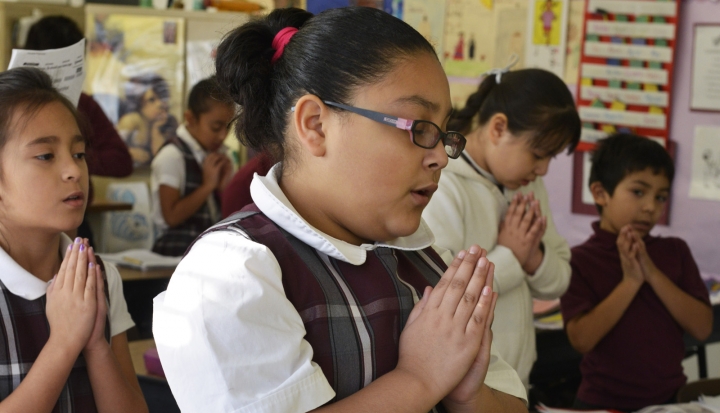 Catholic-school-student-praying