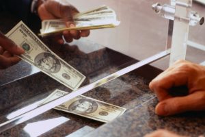 exchanging-money-at-bank-window