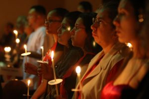 Latinx-catholics-holding-candles