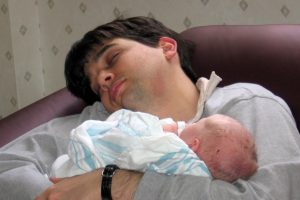exhausted-father-with-baby