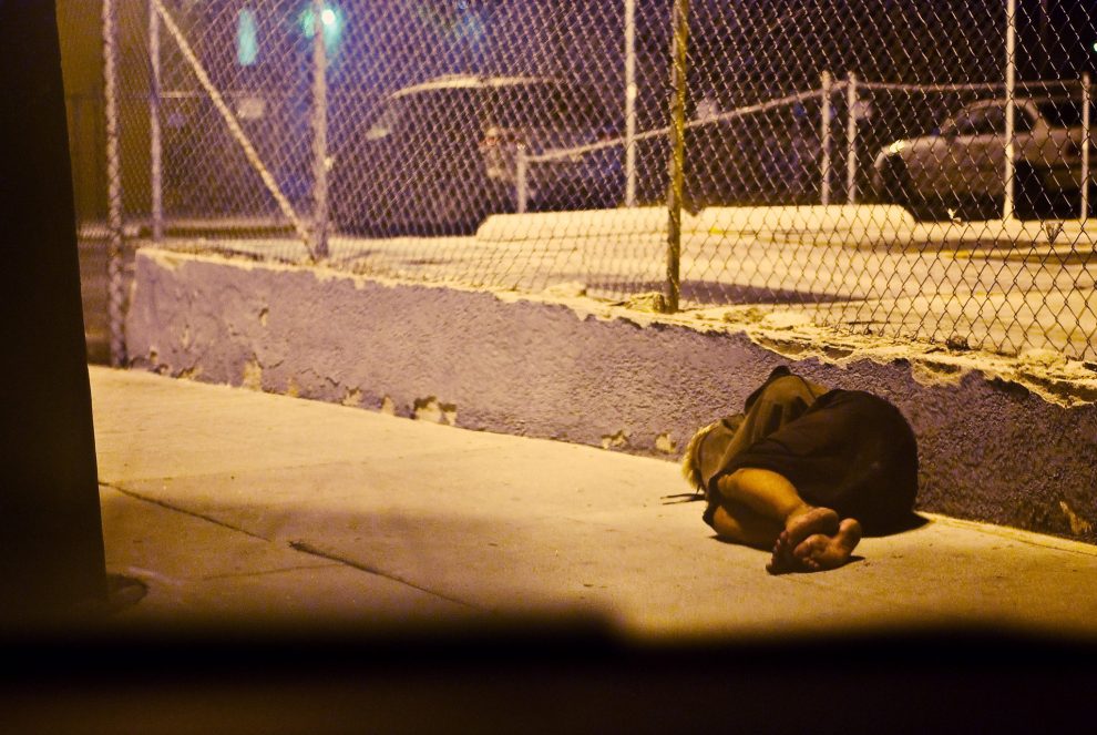 homeless-person-sleeping-on-sidewalk