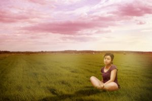 woman-meditating-in-field-illustration