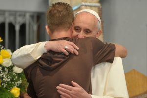 Pope-Francis-hugs-young-adult