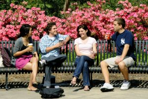 students-talking-on-a-bench