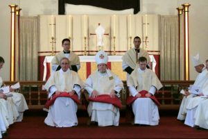 deacons-sitting-at-altar