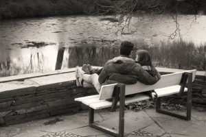 couple-embracing-on-a-bench