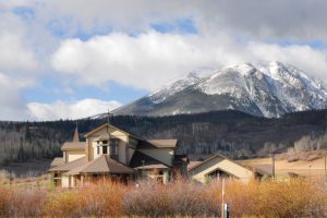 church-on-prairie-with-mountains-in-background