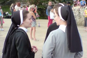 young-nuns-talking-in-a-crowd