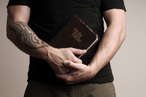 man-holding-bible