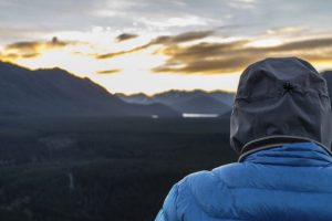 hiker-gazing-at-sunrise-in-winter