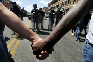 hands-holding-in-front-of-police