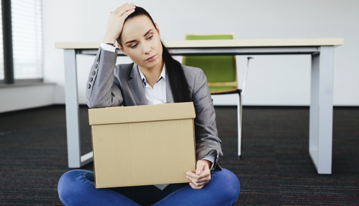 upset-woman-with-box-of-possessions