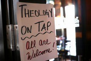 sign-that-says-theology-on-tap-all-are-welcome