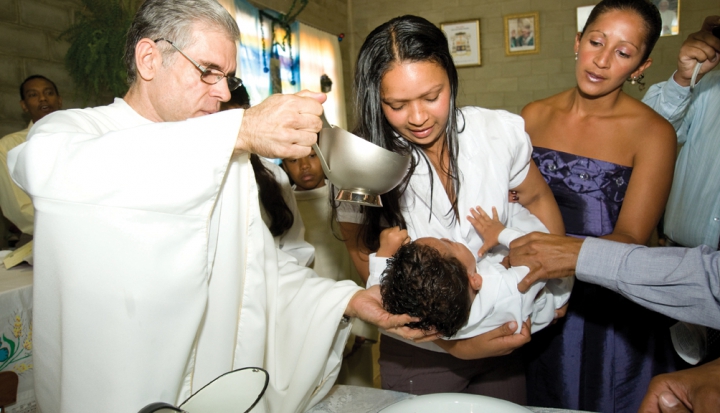 child-being-baptized-by-priest