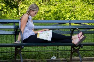 woman-wearing-yoga-pants-and-reading