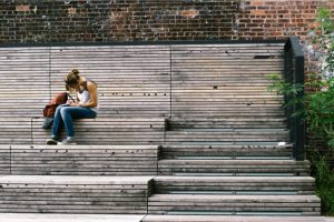 student-sitting-on-steps