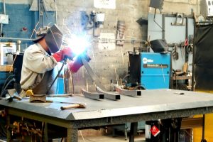 man-welding-in-shop