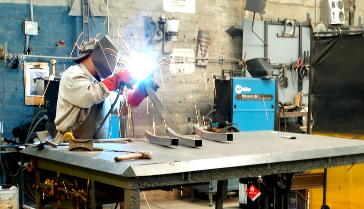 man-welding-in-shop