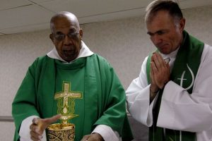 two-priests-wearing-green