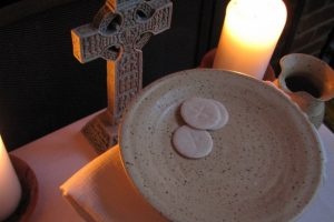 hosts-for-the-eucharist-with-candles-and-a-cross