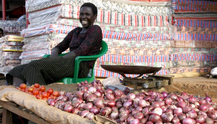 smiling-woman-sitting-by-potatoes