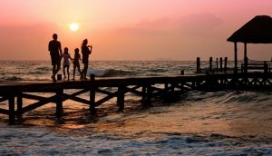 family-on-dock-at-sunset