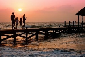 family-on-dock-at-sunset