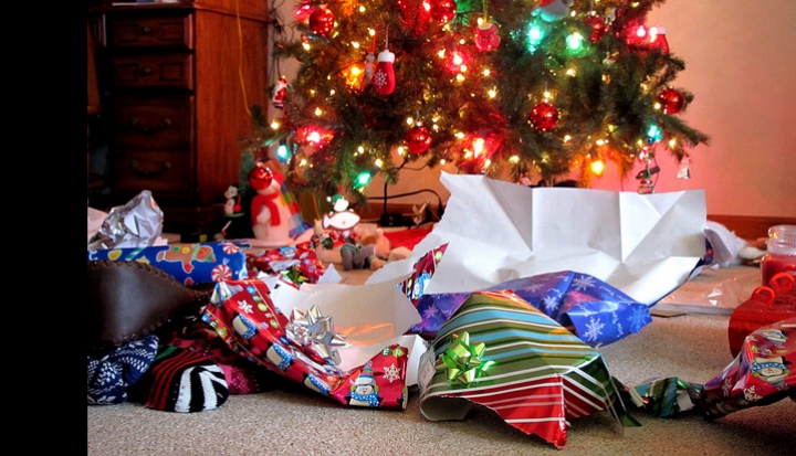 wrapping-paper-scattered-by-christmas-tree