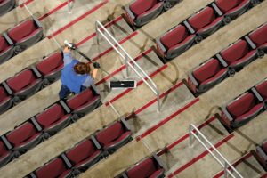 person-cleaning-stadium-seats