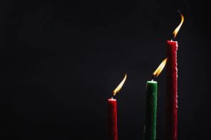 green-and-red-candles-shining-in-darkness