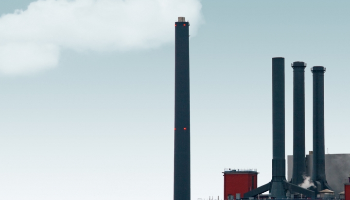 factory-smokestack-in-front-of-a-blue-sky