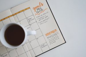 open-planner-with-cup-of-coffee