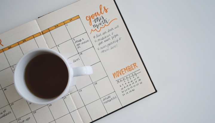 open-planner-with-cup-of-coffee