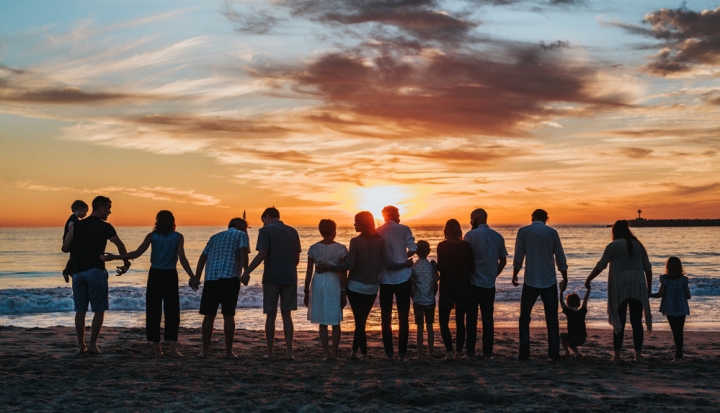 a-group-of-people-against-sunset