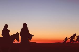 silhouette-of-holy-family-journeying-across-desert