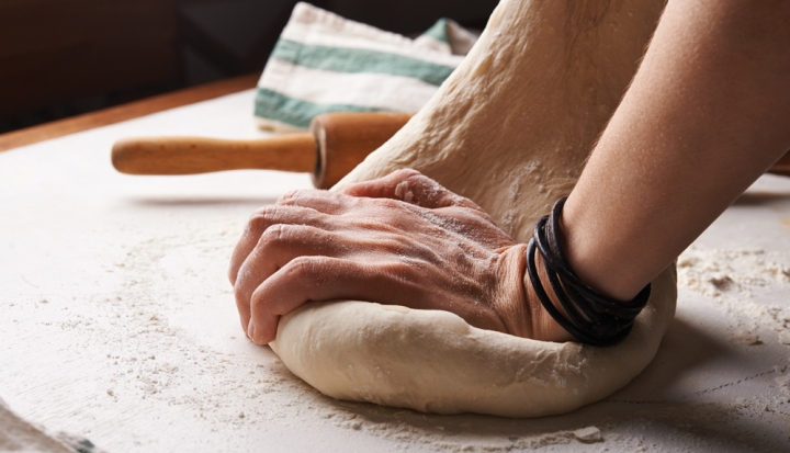 hand-kneads-bread-dough