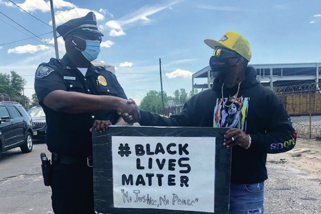 police-officer-and-black-lives-matter-protester-shake-hands