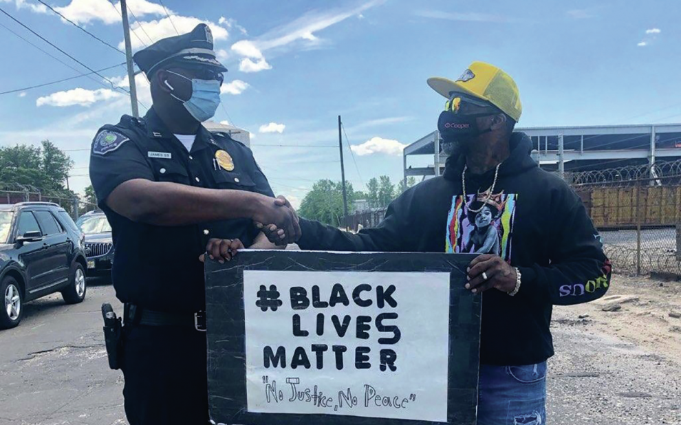 police-officer-and-black-lives-matter-protester-shake-hands