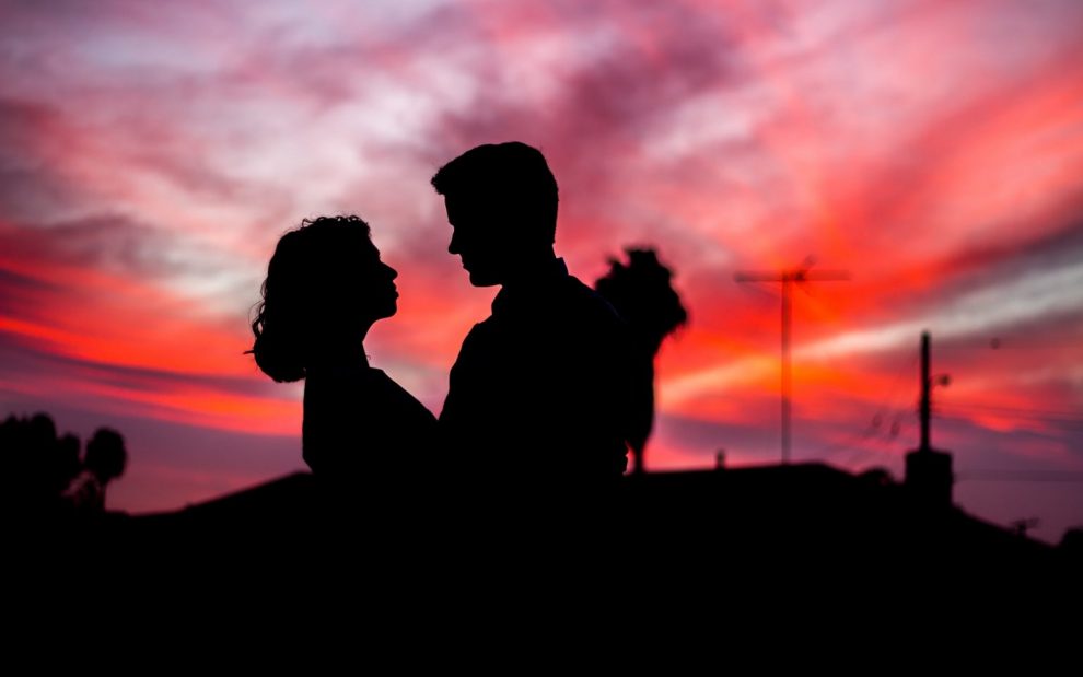 silhouette-of-a-man-and-woman-pink-sunset