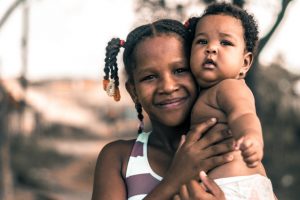 black-woman-holding-infant-child