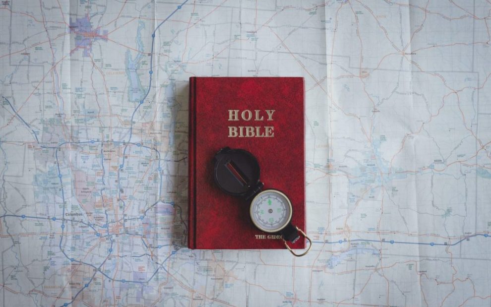 bible-and-compass-on-a-map